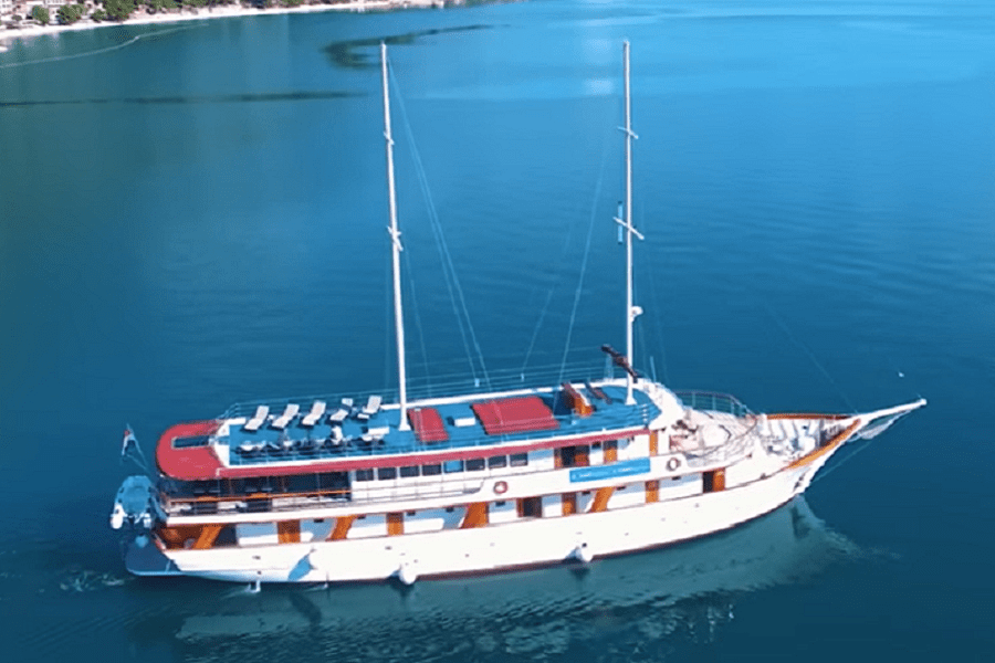 Luxury vessel departing on a Wednesday cruise Croatia journey with passengers on deck