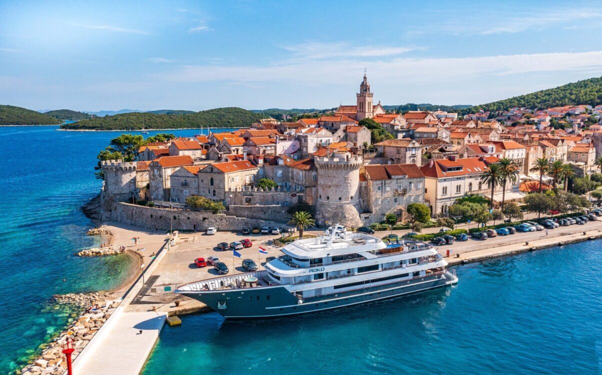Group of cyclists exploring a coastal village during their bike and boat holidays Croatia tour